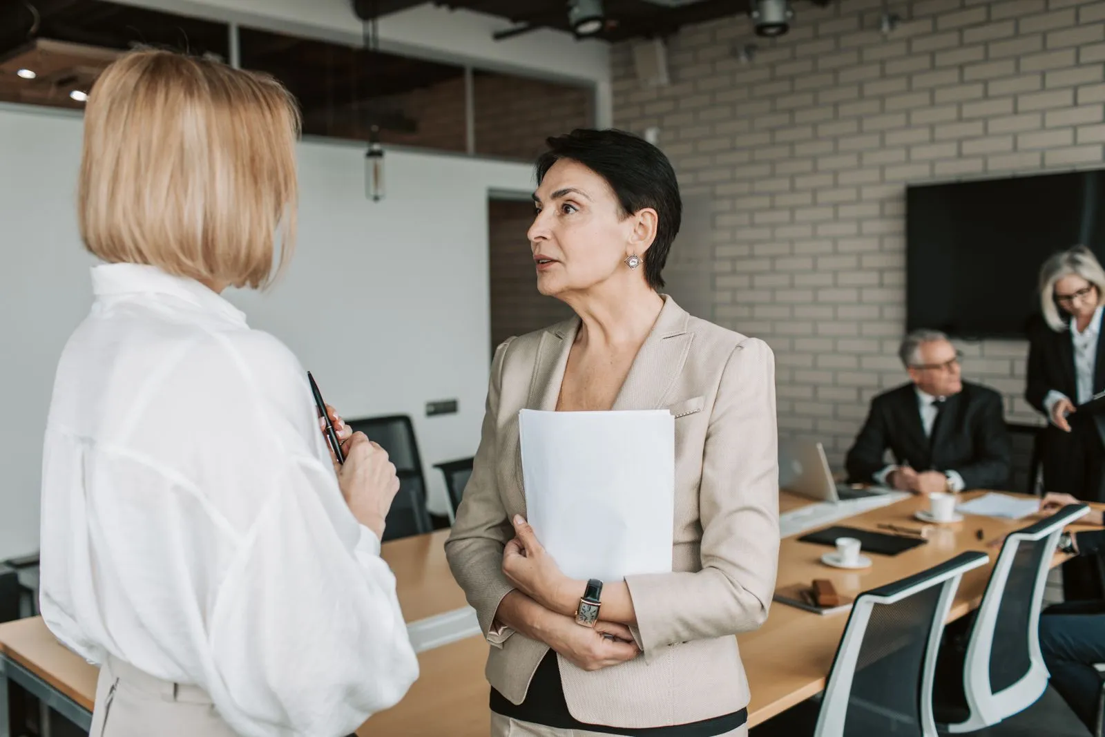 Two colleagues in conversation in an office